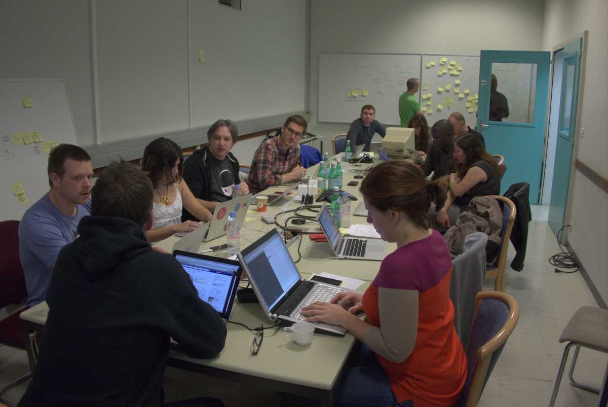 Inside the Universal line-mode browser's 'War room' at CERN - 19th September, 2013. From the top of the table going left: John Allsopp (Australia), Remy Sharp (Britain), Lea Verou (Greece), Jeremy Keith (Britain), Craig Mod (USA / Japan), Sotirios Boutas (Greece), Silvia Tomanin (Italy), Brian Leroux (Canada / San Francisco), Martin Akolo Chiteri (Kenya), Angela Ricci (Brazil / France) and Kimberly Blessing (USA). Standing at the back of the room: Mark Boulton (Wales) and Dan Noyes (Britain). Picture credit: Brian Suda